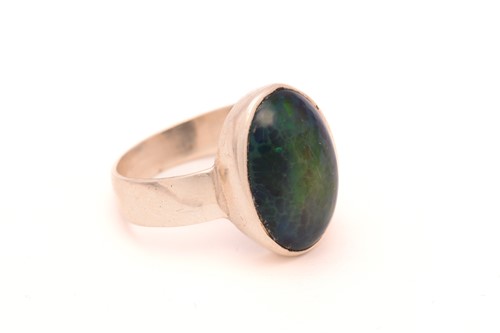 Lot 58 - Two black opal rings; First consists of an...