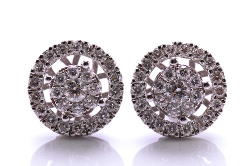 Lot 95 - A pair of diamond cluster ear studs with halo...