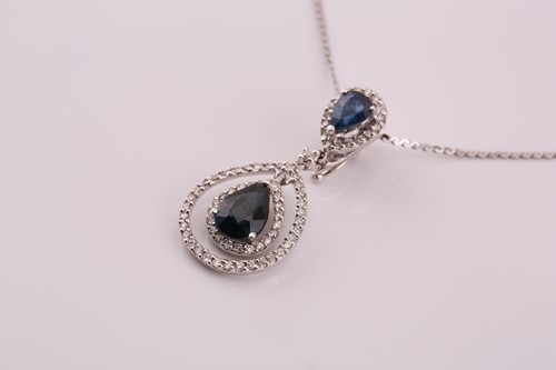 Lot 127 - A sapphire and diamond enhancer pendant on...