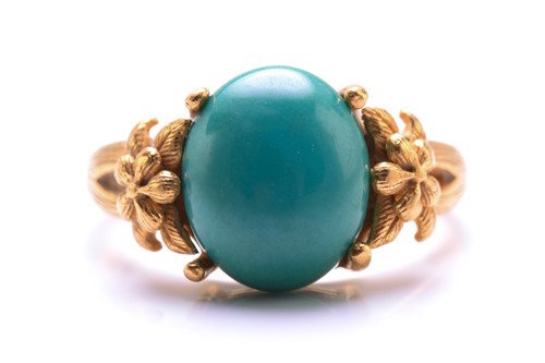 Lot 119 - A turquoise dress ring, featuring an oval...