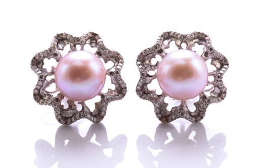 Lot A pair of pearl and diamond earrings, each...