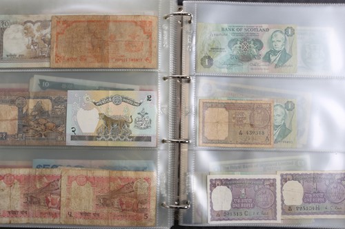 Lot 300 - Three albums of world bank notes, to include a...