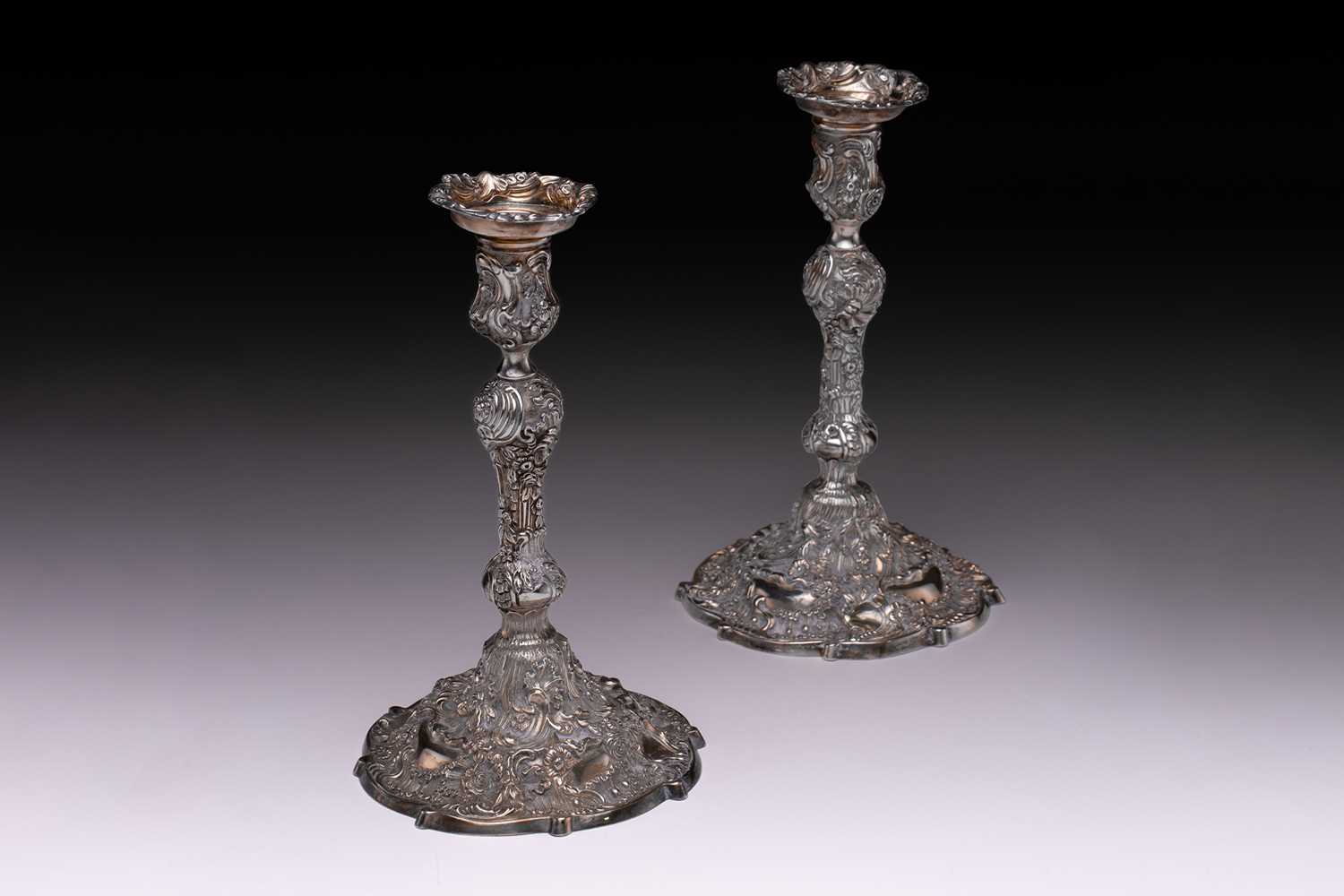 Lot 418 - A pair of 20th century silver candlesticks...