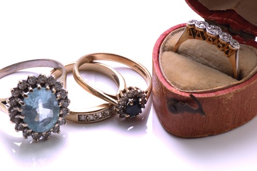 Lot 154 - Four gem-set rings, to include an 18ct gold...