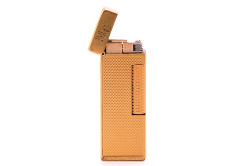 Lot 284 - Dunhill. A gold plated Dunhill lighter, with...