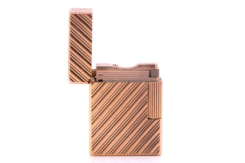 Lot 284 - Dunhill. A gold plated Dunhill lighter, with...