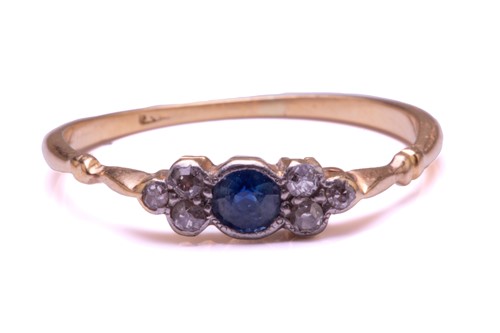 Lot 116 - A diamond and sapphire ring, comprises a round...