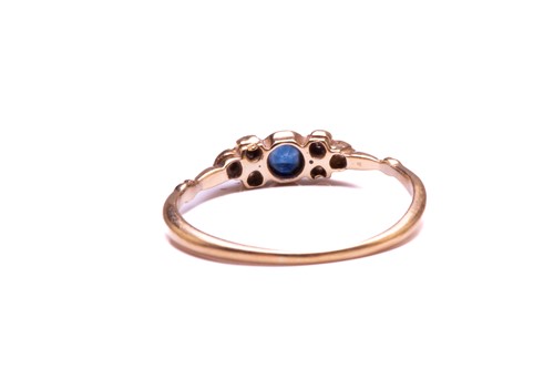 Lot 116 - A diamond and sapphire ring, comprises a round...