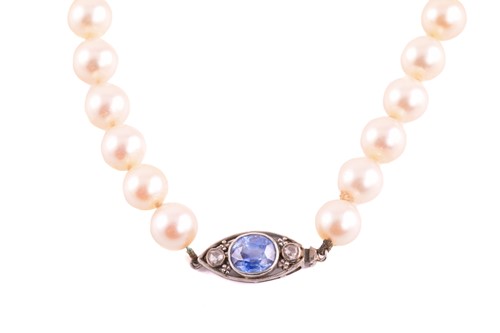 Lot A single row pearl necklace with gem-set clasp,...