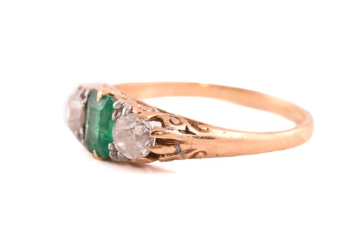 Lot 2 - An emerald and diamond three-stone ring,...