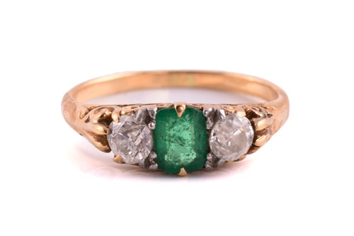 Lot An emerald and diamond three-stone ring,...