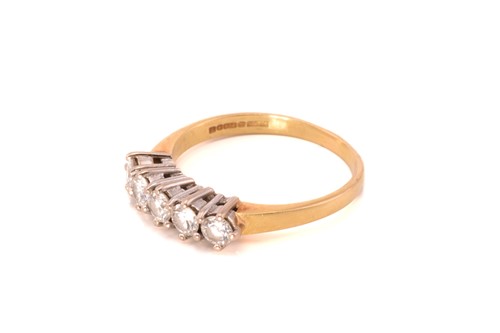 Lot 212 - A five-stone diamond ring in 18ct gold,...