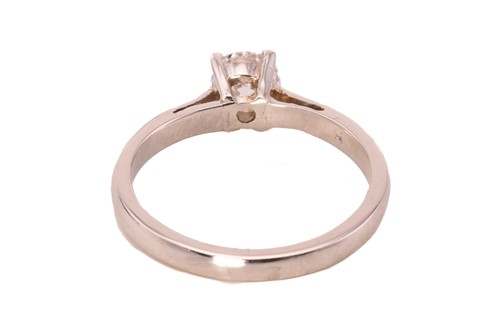 Lot 106 - A diamond solitaire ring in platinum, composed...