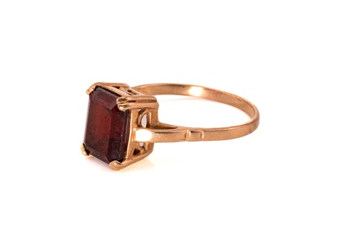 Lot 227 - A 9ct gold and garnet ring and a large citrine...