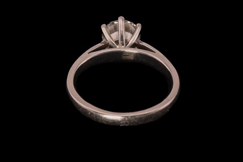 Lot 32 - A diamond solitaire ring in platinum, composed...