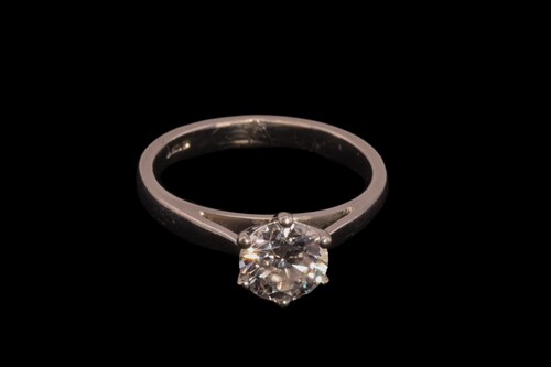 Lot 32 - A diamond solitaire ring in platinum, composed...