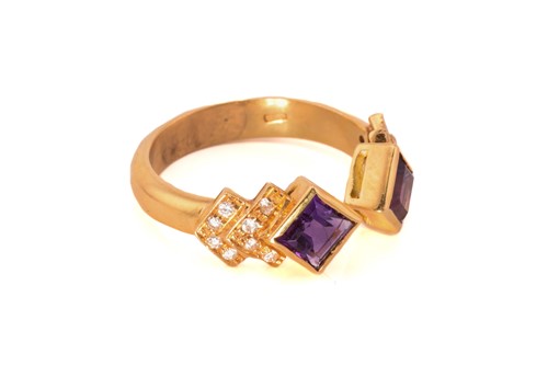Lot 41 - An amethyst and diamond dress ring, featuring...