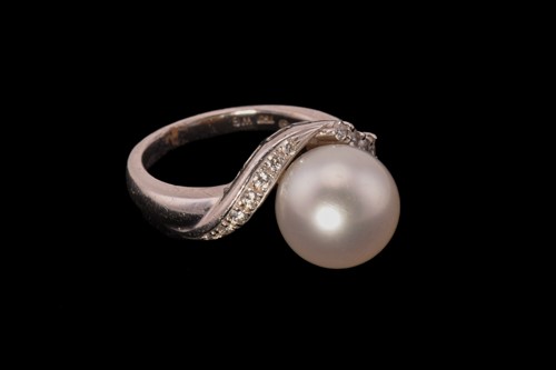 Lot 213 - A Mikimoto pearl and diamond dress ring,...