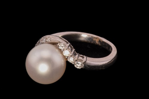 Lot 213 - A Mikimoto pearl and diamond dress ring,...