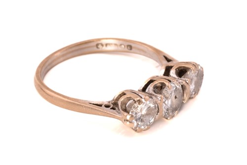 Lot 226 - A three-stone diamond ring in 18ct gold,...