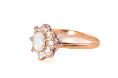 Lot 49 - Two diamond rings and a synthetic opal ring;...