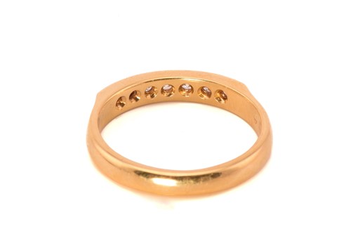 Lot 71 - A diamond half eternity ring in 18ct gold,...