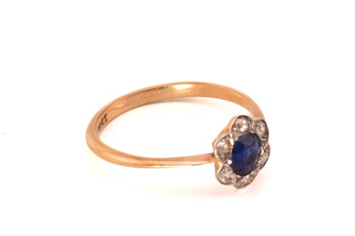 Lot 243 - A sapphire and diamond flower head ring,...