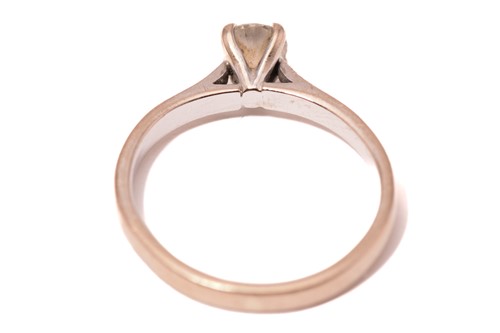 Lot 168 - A diamond solitaire ring in 18ct gold,...