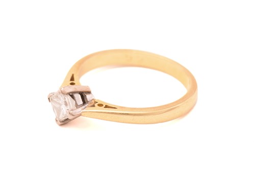 Lot 151 - A princess-cut diamond solitaire ring in 18ct...
