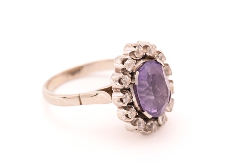 Lot 83 - A synthetic colour-changing sapphire and...