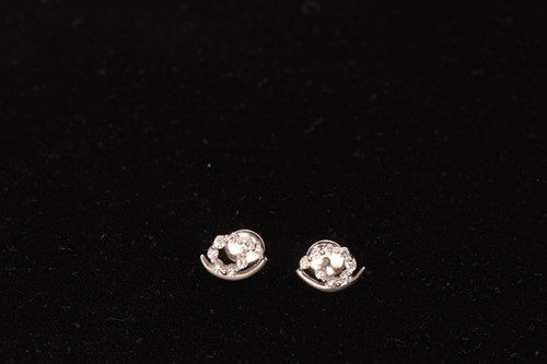 Lot 60 - A diamond ring and a pair of gem-set earrings;...