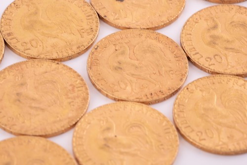 Lot 276 - Eleven 20 French Franc gold coins, with a...
