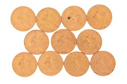Lot 276 - Eleven 20 French Franc gold coins, with a...