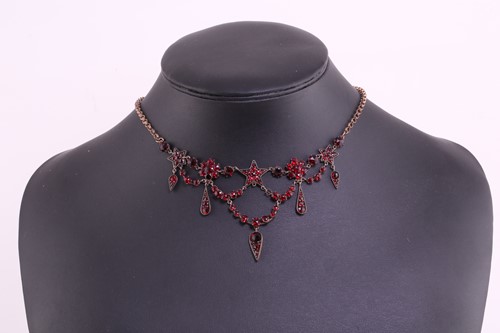 Lot 151 - A garnet and red paste garland necklace in...