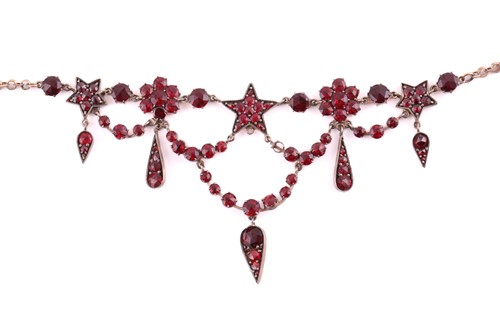 Lot 151 - A garnet and red paste garland necklace in...