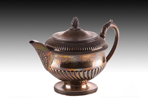 Lot 467 - A George III silver squat teapot of volute...