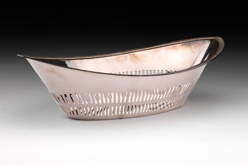 Lot 389 - A continental white metal bread basket of oval...