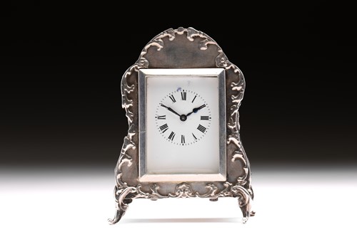 Lot 351 - An Edwardian boudoir clock; white enamel...