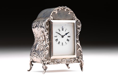 Lot 351 - An Edwardian boudoir clock; white enamel...