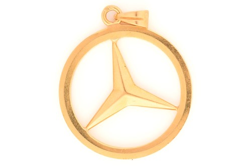 Lot 88 - A Mercedes-Benz logo pendant, featuring the...