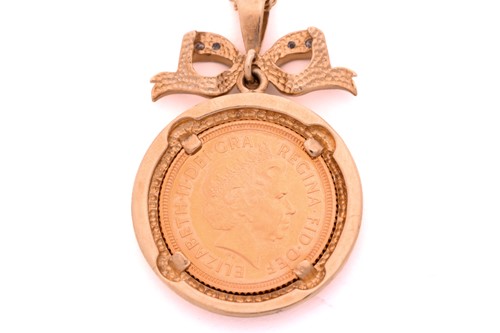 Lot 14 - A sovereign coin pendant on chain, consisting...