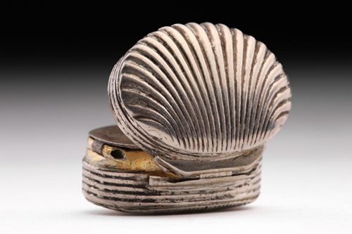 Lot 412 - A 19th century shell-shaped vinaigrette;...