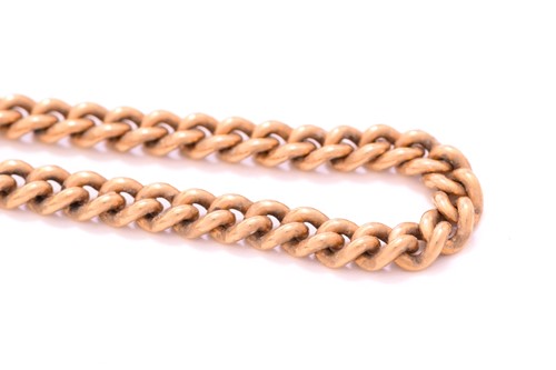 Lot 249 - A curb link endless chain in yellow gold,...