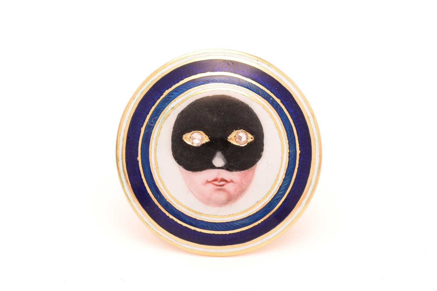 Lot 29 - An enamel masked lady ring, round disc...