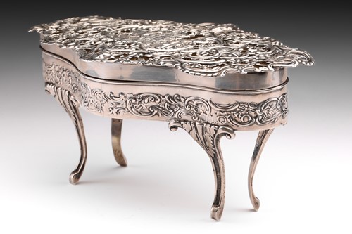 Lot 430 - A large silver dressing table box of bow...