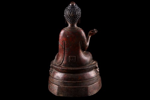 Lot 101 - A Chinese bronze figure of Buddha, seated in...