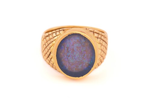 Lot 307 - A black opal signet ring, featuring an oval...