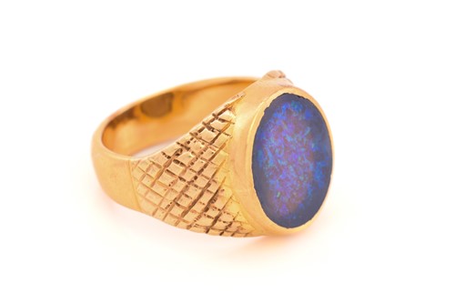 Lot 307 - A black opal signet ring, featuring an oval...