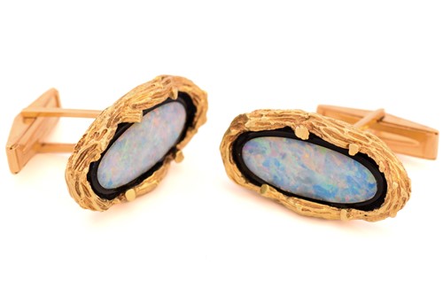 Lot 72 - A pair of Modernist opal cufflinks, each...