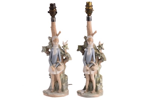 Lot 220 - Two Lladro figural table lamp bases, each...